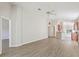 Bright living room with wood floors, an open floor plan, and plenty of natural light at 31447 Shaker Cir, Wesley Chapel, FL 33543
