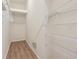Spacious walk-in closet with wood floors and wire shelves at 31447 Shaker Cir, Wesley Chapel, FL 33543