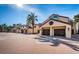 View of garages and the exterior of the townhome featuring a two-car garage and driveway at 732 Pinellas Bayway S, Tierra Verde, FL 33715