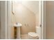Cozy half bath with pedestal sink and toilet at 9406 Citrus Glen Pl, Tampa, FL 33618