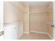 Walk in closet featuring wire shelving and ceramic tile flooring at 9406 Citrus Glen Pl, Tampa, FL 33618