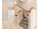 Inviting entryway with staircase and tile flooring at 9406 Citrus Glen Pl, Tampa, FL 33618