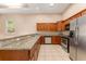 Beautiful kitchen with stainless steel appliances and granite countertops at 9406 Citrus Glen Pl, Tampa, FL 33618
