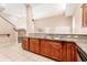 Spacious kitchen with breakfast bar, granite counters, stainless steel appliances at 9406 Citrus Glen Pl, Tampa, FL 33618