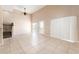 Bright living room with soaring ceilings and tile floors at 9406 Citrus Glen Pl, Tampa, FL 33618