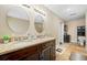 Bathroom with double vanity, granite countertops, and tile floors at 11201 Knotty Pine Dr, New Port Richey, FL 34654