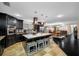 Spacious, modern kitchen with stainless steel appliances, breakfast bar, and open access to the dining area at 11201 Knotty Pine Dr, New Port Richey, FL 34654