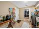 Neat laundry room with storage shelves and access to the kitchen and appliances at 11201 Knotty Pine Dr, New Port Richey, FL 34654