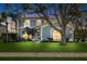 Charming two-story home features a well-manicured lawn, mature trees and tasteful landscaping at 1600 Gray Bark Dr, Oldsmar, FL 34677