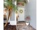 The home's entrance features a decorative wreath, brick pavers, and a well-kept flowerbed at 1600 Gray Bark Dr, Oldsmar, FL 34677