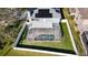 An aerial view of the backyard pool, with a screened enclosure and privacy fence at 1600 Gray Bark Dr, Oldsmar, FL 34677