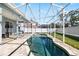 Inviting pool area surrounded by brick pavers and enclosed with a screen at 1600 Gray Bark Dr, Oldsmar, FL 34677