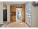 Hallway with built-in wood cabinetry and easy access to backyard and stairs at 3616 W Morrison Ave, Tampa, FL 33629