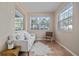 Relaxing sun room with ample natural light, tile floors and comfortable seating area at 3616 W Morrison Ave, Tampa, FL 33629