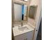 Bathroom featuring a stylish vanity with modern fixtures and lighting at 169 Medallion Blvd # E, Madeira Beach, FL 33708