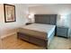 This bedroom offers a cozy retreat, featuring a plush bed and elegant furnishings at 169 Medallion Blvd # E, Madeira Beach, FL 33708