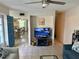 Living room with access to the dining room and kitchen and a blue entry door at 169 Medallion Blvd # E, Madeira Beach, FL 33708