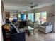 Bright living room with fireplace, comfortable seating, and view of the outdoors at 169 Medallion Blvd # E, Madeira Beach, FL 33708