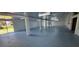 Spacious basement with painted floor and support columns, offering potential for customization at 4514 Dewey Dr, New Port Richey, FL 34652