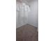 Compact closet space with soft carpet, providing functional storage for robes and other personal items at 4514 Dewey Dr, New Port Richey, FL 34652