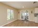 Dining room area featuring plenty of natural light and access to the outside patio at 4514 Dewey Dr, New Port Richey, FL 34652