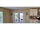 Dining room space with access to the screened in patio and direct access to the kitchen at 4514 Dewey Dr, New Port Richey, FL 34652