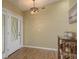 Bright foyer showcasing wood floors, decorative light fixture, and stylish console table at 4514 Dewey Dr, New Port Richey, FL 34652