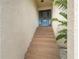 Inviting front entrance features a blue door and stairs leading up to the home at 4514 Dewey Dr, New Port Richey, FL 34652
