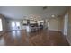 Open concept kitchen with breakfast bar, stainless appliances, stylish lighting fixtures, and sliding doors at 4514 Dewey Dr, New Port Richey, FL 34652