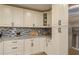 Close up of the kitchen with stainless steel refrigerator and plenty of counter and cabinet space at 4514 Dewey Dr, New Port Richey, FL 34652