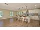 Open-concept kitchen with island seating, modern cabinets, and sleek appliances at 4514 Dewey Dr, New Port Richey, FL 34652