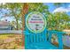 Private beach club member sign with blue chair and tropical surroundings at 4514 Dewey Dr, New Port Richey, FL 34652