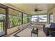 Relaxing sunroom with comfortable seating and outdoor views, perfect for enjoying tranquil moments at 4514 Dewey Dr, New Port Richey, FL 34652