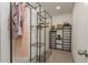 Functional walk-in closet with metal shelving, offering ample storage solutions for an organized space at 4514 Dewey Dr, New Port Richey, FL 34652