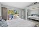 Relaxing bedroom featuring mirrored closet doors and sliding glass door access to the lanai at 4531 Swordfish Dr, Bradenton, FL 34208