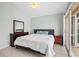 Bedroom featuring neutral walls, tiled floors, a ceiling fan, and sliding glass door at 4531 Swordfish Dr, Bradenton, FL 34208