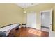 Bonus room featuring hardwood floors, an air hockey table, and a large closet at 4531 Swordfish Dr, Bradenton, FL 34208
