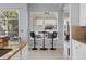 Cozy breakfast nook with tile flooring, a modern table and chairs, and views of the outdoors at 4531 Swordfish Dr, Bradenton, FL 34208
