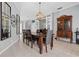 Dining room featuring tile floors, contemporary light fixture, and views of the living area at 4531 Swordfish Dr, Bradenton, FL 34208