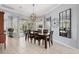 Elegant dining room with stylish lighting and views of screened lanai at 4531 Swordfish Dr, Bradenton, FL 34208