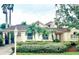 Charming single-Gathering home with lush landscaping, well-manicured lawn, and porte-cochere at 4531 Swordfish Dr, Bradenton, FL 34208