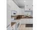 Bright kitchen features white cabinets, stainless steel appliances and granite counters at 4531 Swordfish Dr, Bradenton, FL 34208