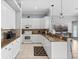 Bright kitchen with white cabinetry, granite countertops, stainless steel appliances, and an open bar area at 4531 Swordfish Dr, Bradenton, FL 34208