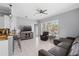 Open-concept living room with tile floors, a ceiling fan, comfortable seating, and plenty of natural light at 4531 Swordfish Dr, Bradenton, FL 34208