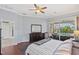 Main bedroom featuring hardwood floors, a sliding glass door, and a view of the pool area at 4531 Swordfish Dr, Bradenton, FL 34208
