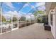 Spacious screened-in patio with a grill, ample seating, and a view of the surrounding landscape at 4531 Swordfish Dr, Bradenton, FL 34208