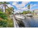 Beautiful waterfront property with private boat dock, surrounded by lush tropical landscaping and serene canal views at 4531 Swordfish Dr, Bradenton, FL 34208