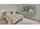 Bedroom with a large window overlooking the lawn at 10412 Ireland St, Spring Hill, FL 34608