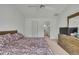 Well-lit bedroom with ceiling fan and en-suite bathroom at 10412 Ireland St, Spring Hill, FL 34608