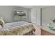 Bedroom with a large window overlooking the lawn, and two closets at 10412 Ireland St, Spring Hill, FL 34608